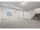 Spacious finished basement with stairs and window at 7988 Kersey Dr, Indianapolis, IN 46236