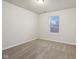 Bright bedroom with neutral walls, carpet flooring, and a window with blinds at 7988 Kersey Dr, Indianapolis, IN 46236