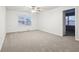 Bright bedroom with ceiling fan and carpet at 7988 Kersey Dr, Indianapolis, IN 46236