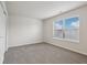 Bright bedroom with neutral walls and carpet at 7988 Kersey Dr, Indianapolis, IN 46236