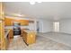 Kitchen features wood cabinets, granite countertops, and stainless steel appliances at 7988 Kersey Dr, Indianapolis, IN 46236