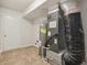 Laundry room with washer, dryer hookups, and tile floor at 7988 Kersey Dr, Indianapolis, IN 46236