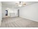 Spacious loft area with ceiling fan and carpet at 7988 Kersey Dr, Indianapolis, IN 46236