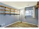 Bedroom with floating shelves and a window, wood-look floors at 88 Sherman Dr, Carmel, IN 46032