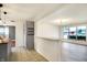 Open kitchen with gray cabinets, a large island, and stylish lighting at 88 Sherman Dr, Carmel, IN 46032