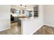 Modern kitchen with gray cabinets, white tile, and kitchen island at 88 Sherman Dr, Carmel, IN 46032