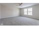 Spacious bedroom with grey carpet and ceiling fan at 9407 W Swimming Hole Ln, Pendleton, IN 46064