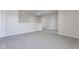 Upstairs hallway with gray carpet and doors at 9407 W Swimming Hole Ln, Pendleton, IN 46064