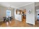 Dining area with hardwood floors and kitchen with stainless steel appliances at 9774 Herring Gull Dr, Carmel, IN 46280