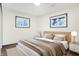 Cozy bedroom with a light wood platform bed and neutral color palette at 11010 Broadway St, Carmel, IN 46280