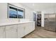 Updated kitchen featuring white shaker cabinets, stainless steel appliances, and quartz countertops at 11010 Broadway St, Indianapolis, IN 46280