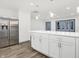 Modern kitchen with white cabinets, stainless steel appliances, and quartz countertops at 11010 Broadway St, Indianapolis, IN 46280