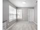 Bright dining area with gray walls and wood-look flooring at 11552 Glenn Abbey Ln, Indianapolis, IN 46235