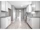 Modern kitchen with white cabinets, granite countertops, and open layout at 11552 Glenn Abbey Ln, Indianapolis, IN 46235