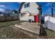 Backyard with a deck, red door, and a beige umbrella at 1601 Spruce St, Indianapolis, IN 46203