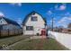 House's rear view showcasing a deck and fenced backyard at 1601 Spruce St, Indianapolis, IN 46203