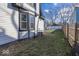 Side yard with a grassy area and a wooden fence at 1601 Spruce St, Indianapolis, IN 46203