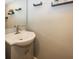 Simple bathroom with a single vanity and updated fixtures at 1601 Spruce St, Indianapolis, IN 46203