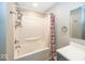 Bathroom with bathtub and shower, and gray vanity at 1601 Spruce St, Indianapolis, IN 46203