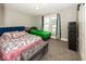 Spacious bedroom with a queen bed and a twin bed at 1601 Spruce St, Indianapolis, IN 46203