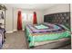 Spacious bedroom with a large bed and window with curtains at 1601 Spruce St, Indianapolis, IN 46203