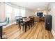 Bright dining area with hardwood floors and seating for six at 1601 Spruce St, Indianapolis, IN 46203