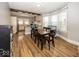 Dining area with wood table, chairs, and kitchen access at 1601 Spruce St, Indianapolis, IN 46203