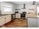 Updated kitchen with granite countertops and stainless steel appliances at 1601 Spruce St, Indianapolis, IN 46203