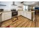 Open concept kitchen with granite island and stainless steel appliances at 1601 Spruce St, Indianapolis, IN 46203