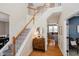 Bright entryway with hardwood floors and staircase at 16736 Lakeville Xing, Westfield, IN 46074