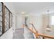 Upstairs hallway with neutral decor and a view of a bedroom at 16736 Lakeville Xing, Westfield, IN 46074