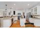 Modern kitchen with island, stainless steel appliances and hardwood floors at 16736 Lakeville Xing, Westfield, IN 46074