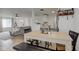 Bright dining area with light wood table and four chairs, adjacent to living room at 1803 Ashley Dr, Lebanon, IN 46052