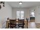 Dining area with table and chairs, access to patio, and bedroom view at 1803 Ashley Dr, Lebanon, IN 46052