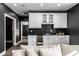 Modern basement bar with white cabinets and dark countertops at 2045 Finchley Rd, Carmel, IN 46032