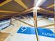 Unfinished attic space with wooden beams and plywood flooring at 2882 N Indiana 13, Anderson, IN 46011