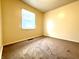 Simple bedroom with carpeted floors and window at 5557 E 41St St, Indianapolis, IN 46226