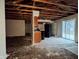 Unfinished kitchen area with partial cabinetry and exposed ceiling beams at 5701 Regency Dr, Indianapolis, IN 46224