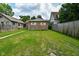 Backyard with detached garage and grassy area at 936 N Oxford St, Indianapolis, IN 46201