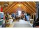 Finished attic offering substantial storage space with flooring and shelving at 1398 Penny Ln, Greenfield, IN 46140