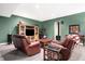 Finished basement recreational area with two comfortable sofas and a large TV at 1398 Penny Ln, Greenfield, IN 46140