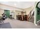 Finished basement featuring home gym, wet bar, and carpeted floors at 1398 Penny Ln, Greenfield, IN 46140