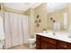 Clean bathroom with shower, toilet, and vanity with storage at 1398 Penny Ln, Greenfield, IN 46140