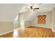 Spacious bedroom with hardwood floors, ceiling fan, textured walls, and natural light at 1398 Penny Ln, Greenfield, IN 46140