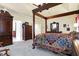 Spacious main bedroom with a large four poster bed and ample closet space at 1398 Penny Ln, Greenfield, IN 46140