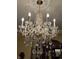 Crystal chandelier with gold accents and decorative ceiling medallion at 1398 Penny Ln, Greenfield, IN 46140