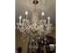 Crystal chandelier with multiple lights perfect for a dining room or living room at 1398 Penny Ln, Greenfield, IN 46140