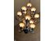 Detailed chandelier featuring decorative lamps and ornate metalwork at 1398 Penny Ln, Greenfield, IN 46140