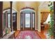 Elegant entryway with hardwood floors, stained glass door, and ornate details at 1398 Penny Ln, Greenfield, IN 46140