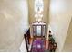 Two-story entryway with hardwood floors, stained glass door, and chandelier at 1398 Penny Ln, Greenfield, IN 46140